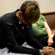 Ahmaud Arbery’s mother Wanda Cooper-Jones reacts to autopsy photos entered into evidence during the trial of Greg McMichael and his son, Travis McMichael, and a neighbor, William “Roddie” Bryan in the Glynn County Courthouse on November 16, 2021 in Brunswick, Georgia.